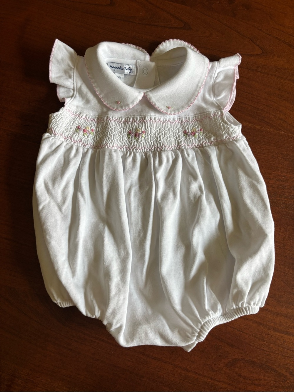 Magnolia Baby hand smocked white Pima cotton bubble romper pink rosebuds